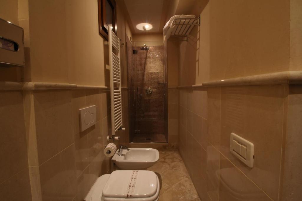 Koupelna v ubytování Hotel Le Isole