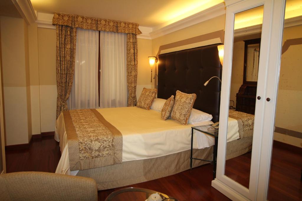 Postel nebo postele na pokoji v ubytování Hotel Le Isole