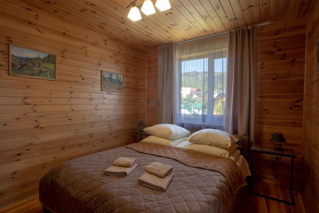 Postel nebo postele na pokoji v ubytování Guest House Бескид