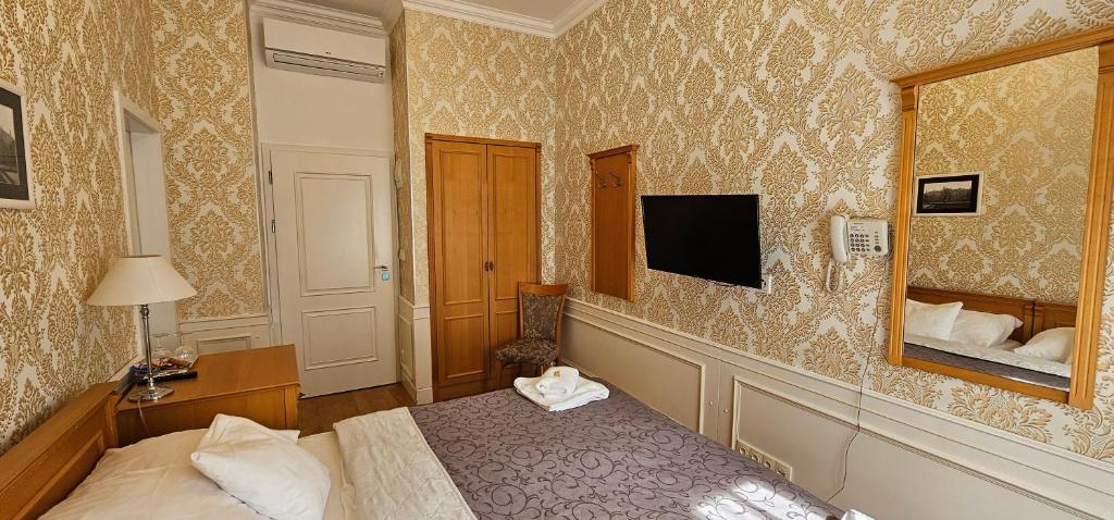 TV a/nebo společenská místnost v ubytování Zamecky Hotel Lednice