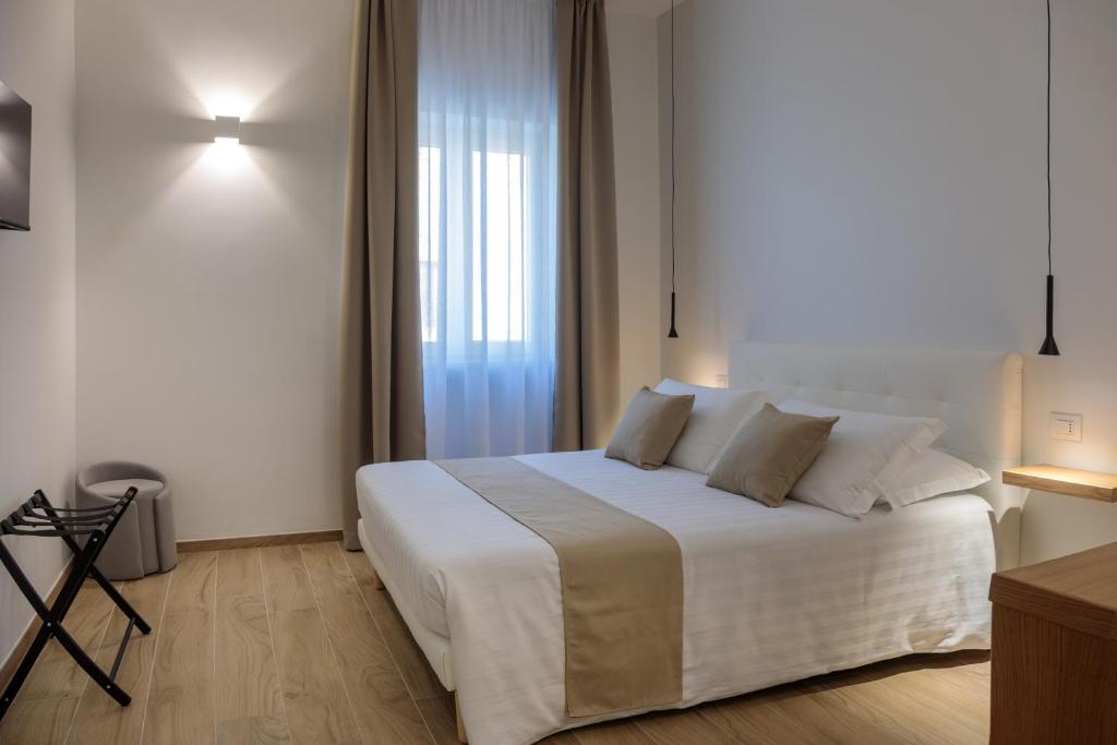 Postel nebo postele na pokoji v ubytování Blanco B&B - Group