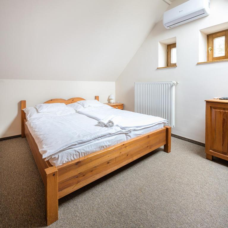 A bed or beds in a room at Vinatus Pince