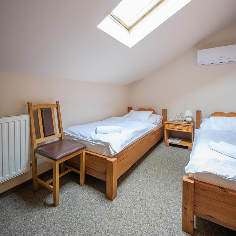 A bed or beds in a room at Vinatus Pince