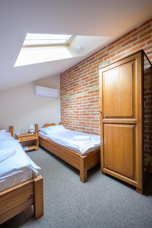 A bed or beds in a room at Vinatus Pince