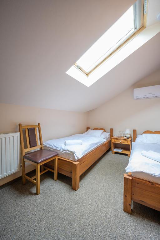 A bed or beds in a room at Vinatus Pince