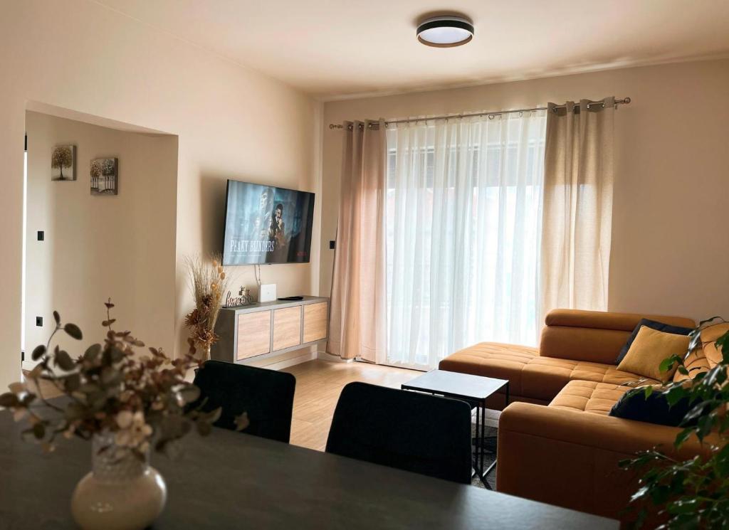 a living room with a couch and a table at Apartment Mate in Pridraga