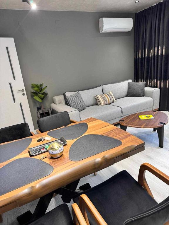 a living room with a table and a couch at Premium Suites in Stara Zagora