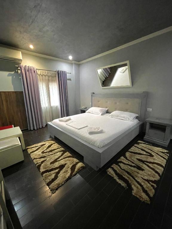 Postel nebo postele na pokoji v ubytování Imperium Hotel
