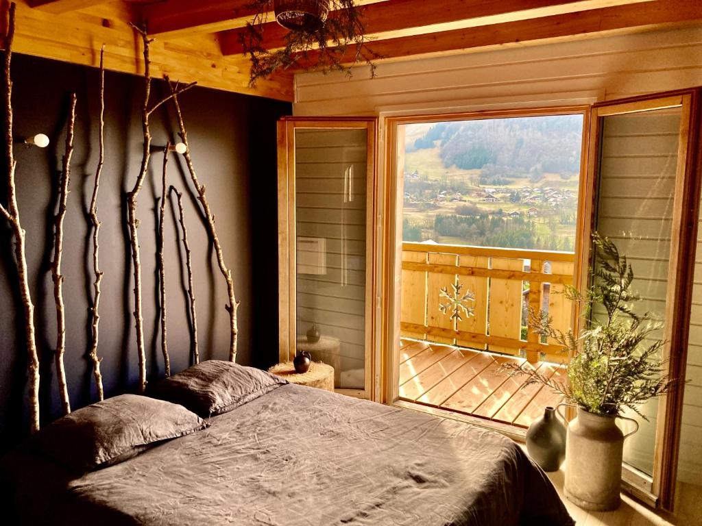 Postel nebo postele na pokoji v ubytování Châlet du gîte des enfants sauvages