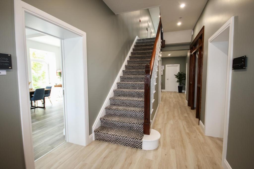 a staircase in a home with a glass door at Carrick Gate in Carrick