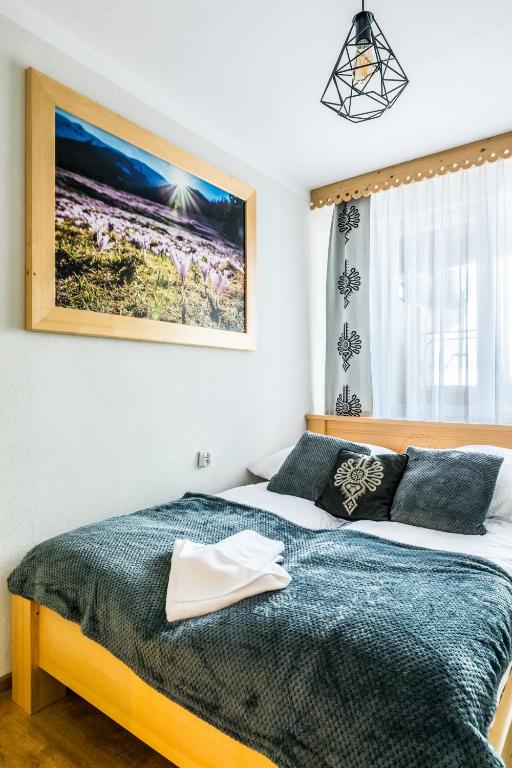 Posteľ alebo postele v izbe v ubytovaní Apartament Regionalny Centrum