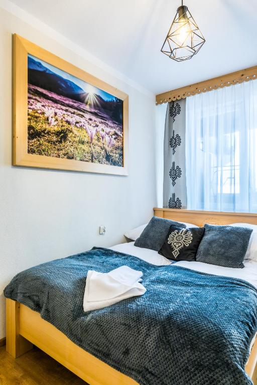 Posteľ alebo postele v izbe v ubytovaní Apartament Regionalny Centrum