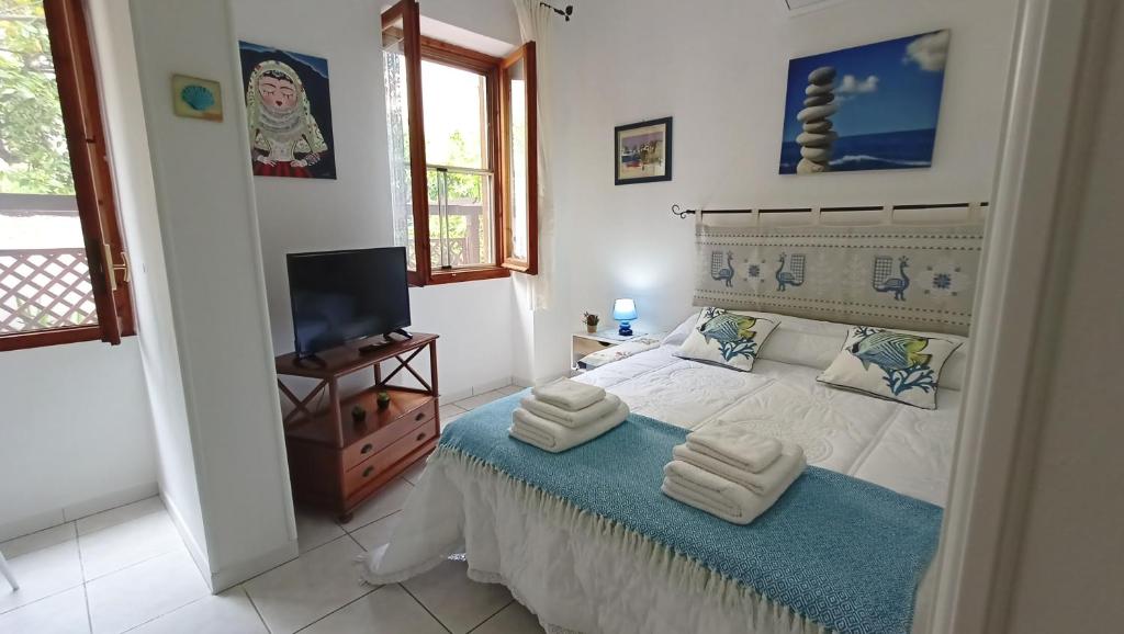 Postel nebo postele na pokoji v ubytování Le Peonie Guest House