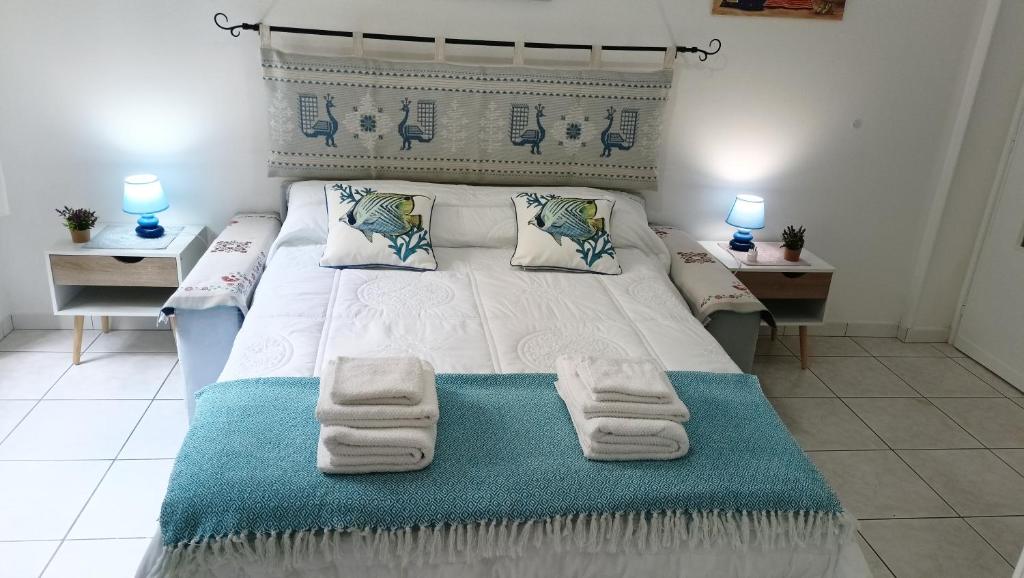Postel nebo postele na pokoji v ubytování Le Peonie Guest House