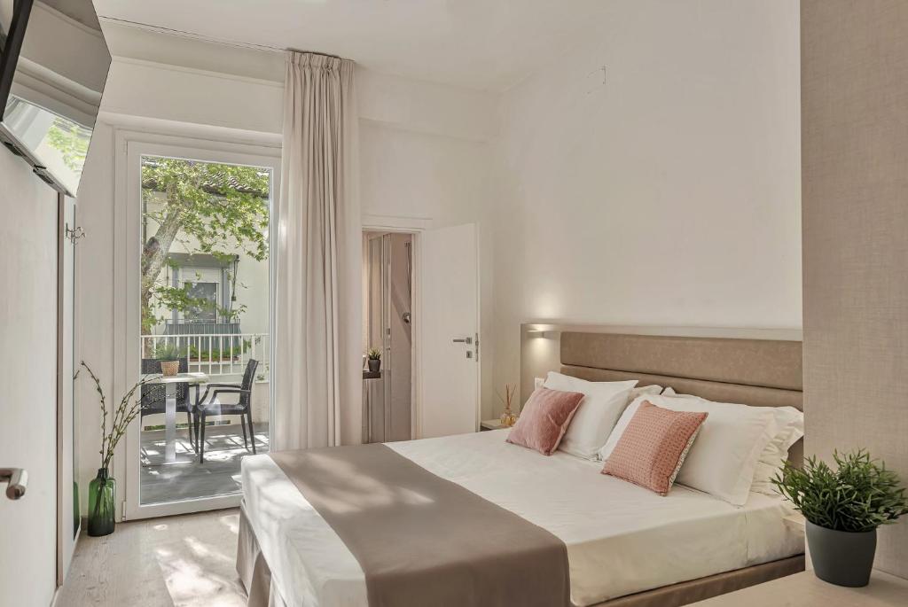 Postel nebo postele na pokoji v ubytování Hotel Lux