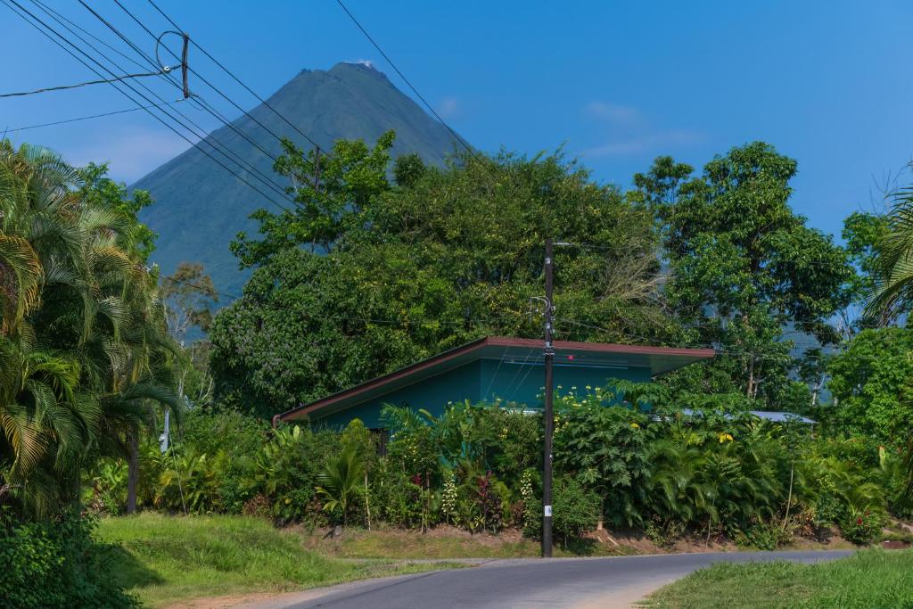 a house on a road with a mountain in the background at Vacation Home Bartenderluisch in Fortuna