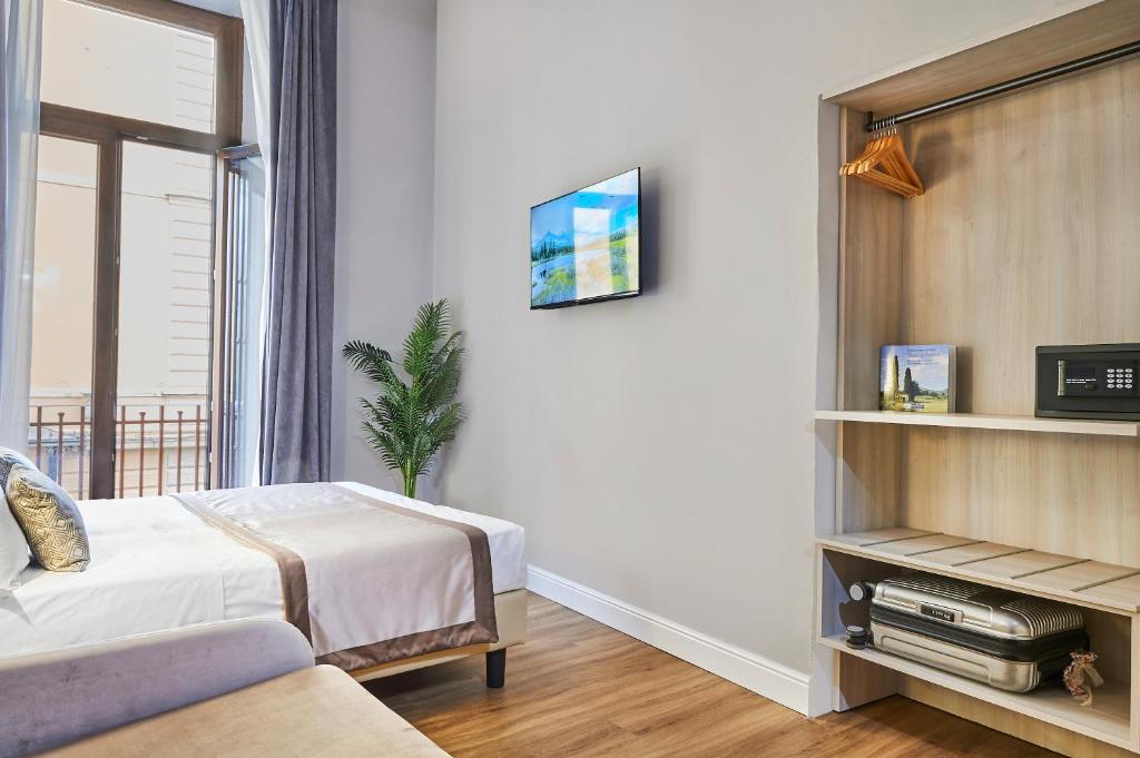 Postel nebo postele na pokoji v ubytování Hotel Brooklyn - ex Hotel Lombardi