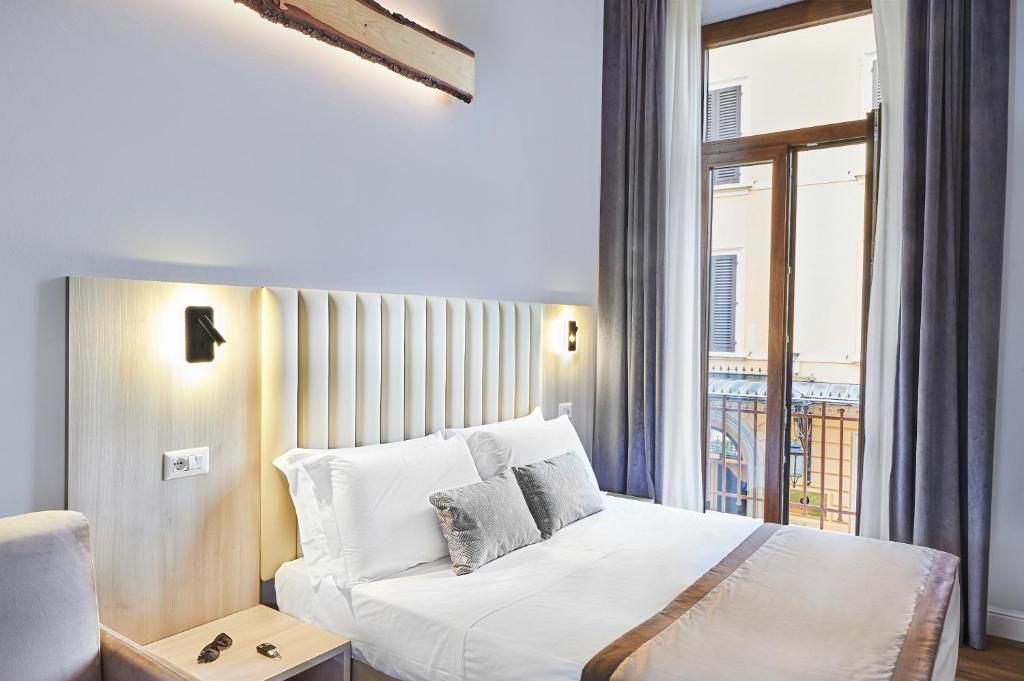 Postel nebo postele na pokoji v ubytování Hotel Brooklyn - ex Hotel Lombardi