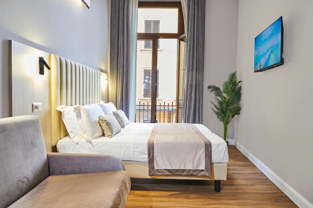 Postel nebo postele na pokoji v ubytování Hotel Brooklyn - ex Hotel Lombardi