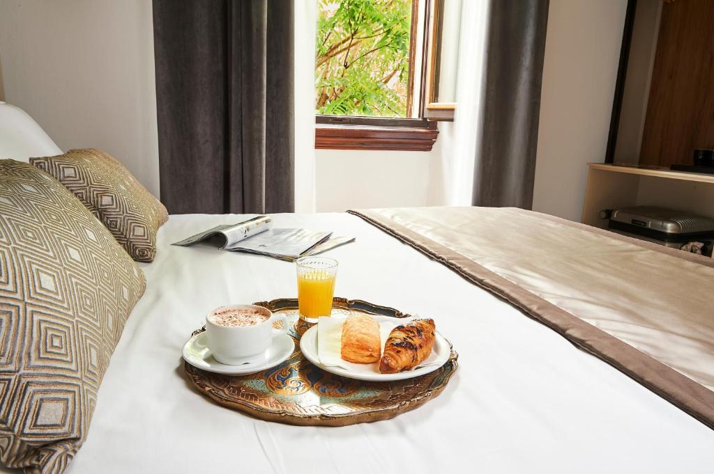 Postel nebo postele na pokoji v ubytování Hotel Brooklyn - ex Hotel Lombardi