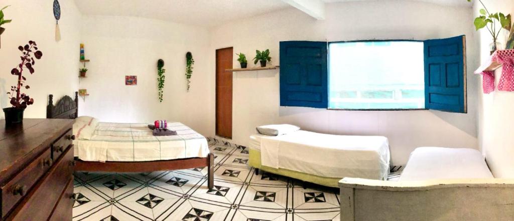 Postel nebo postele na pokoji v ubytování Tranquilandia Hostel