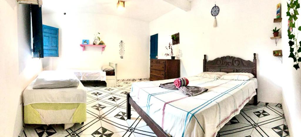 Postel nebo postele na pokoji v ubytování Tranquilandia Hostel