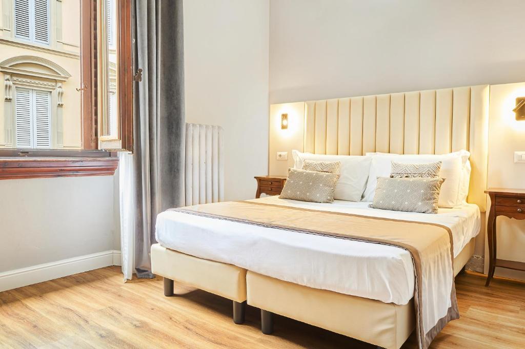 Postel nebo postele na pokoji v ubytování Hotel Brooklyn - ex Hotel Lombardi
