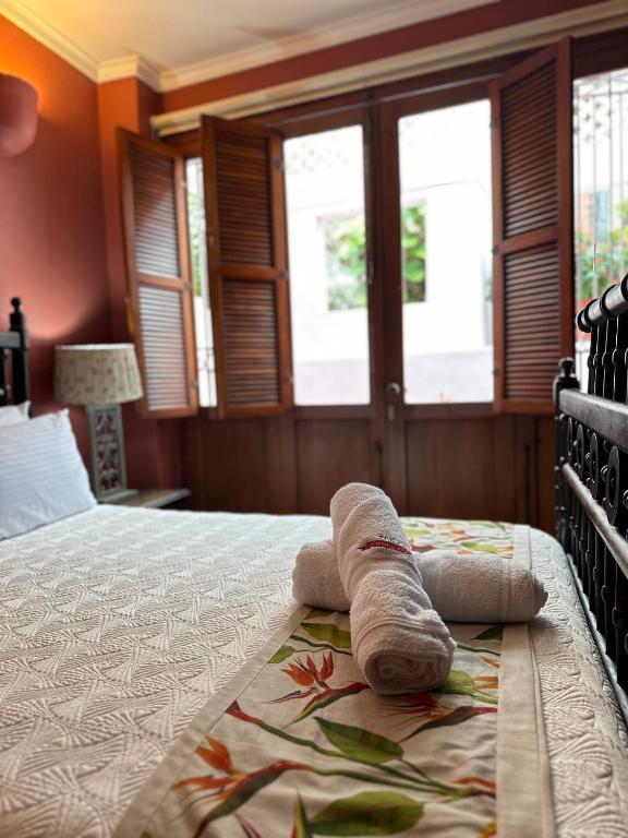 Postel nebo postele na pokoji v ubytování Hotel Boutique Casa Córdoba Estrella