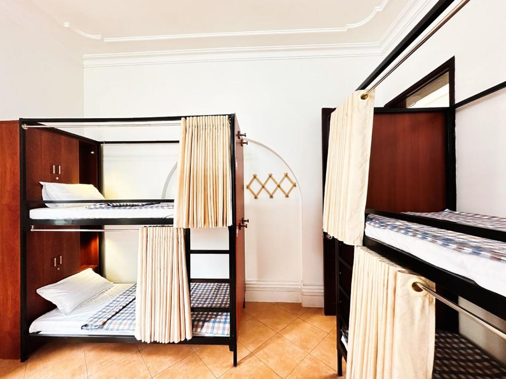 a room with two bunk beds in a hostel at Tuna Homestay Hanoi & Experience in Hanoi
