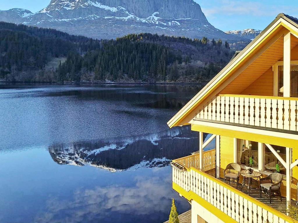a house with a view of a lake and a mountain at Holiday home Bygstad in Bygstad