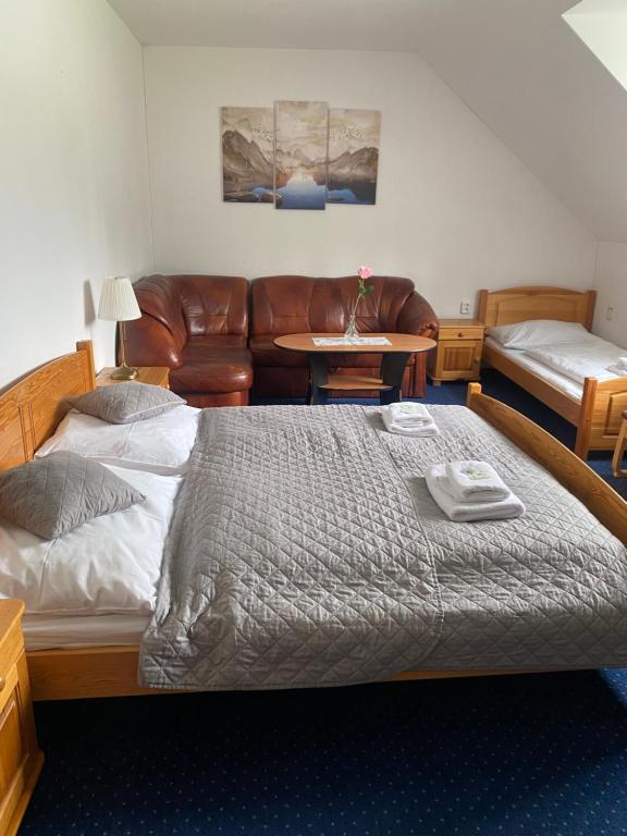 Postel nebo postele na pokoji v ubytování Hotel Stará Ameryka