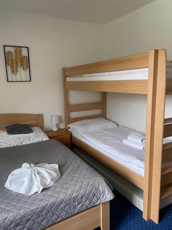 Postel nebo postele na pokoji v ubytování Hotel Stará Ameryka