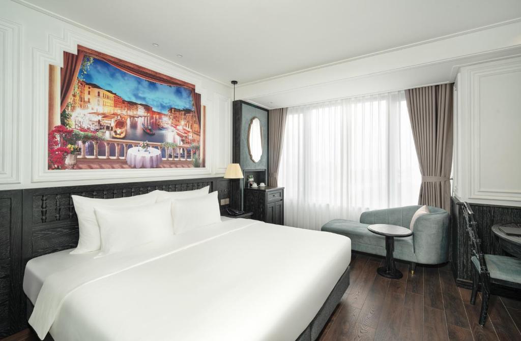 Postel nebo postele na pokoji v ubytování Luxe Paradise Premium Hotel Pham Hong Thai