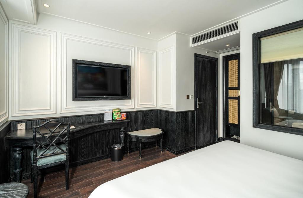 Postel nebo postele na pokoji v ubytování Luxe Paradise Premium Hotel Pham Hong Thai