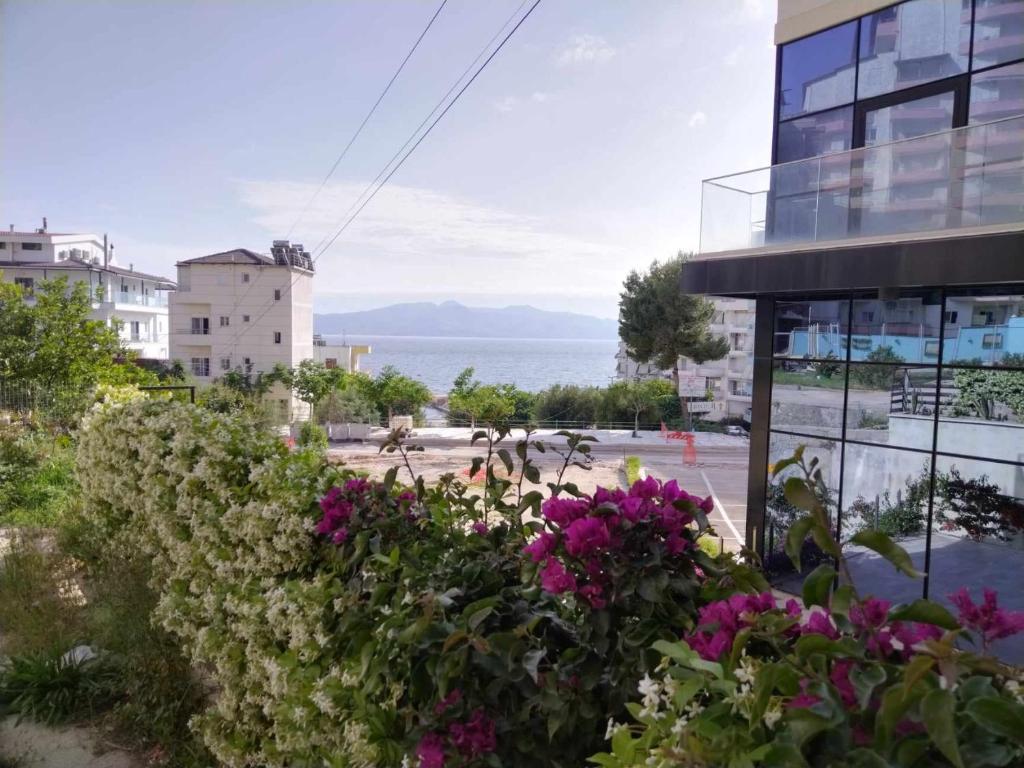 a view of the ocean from a building at Apartment TEONA in Sarandë