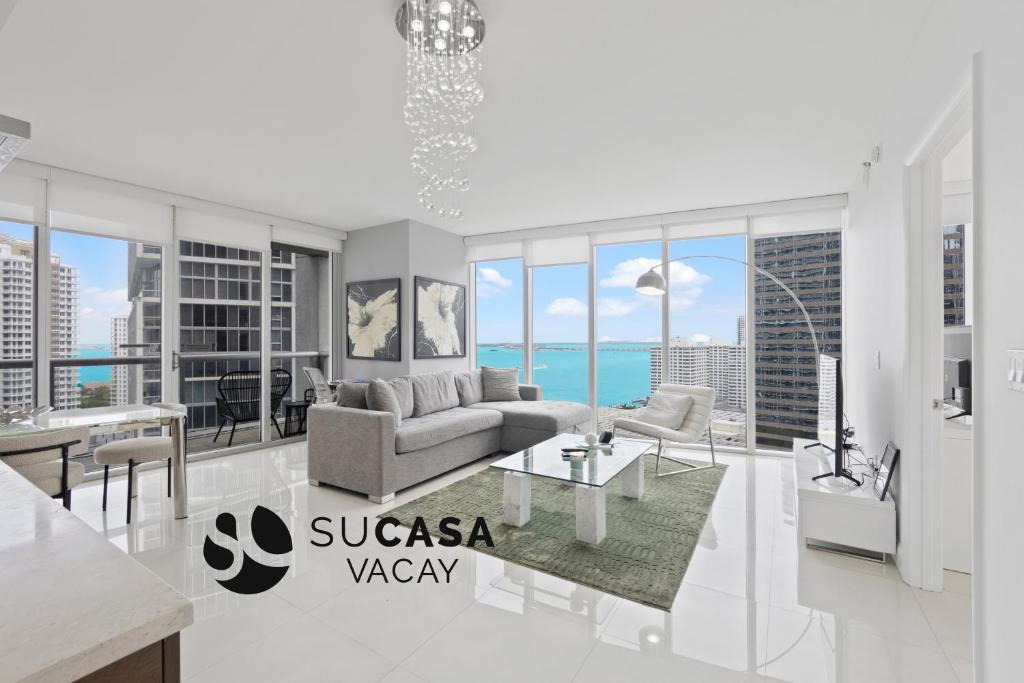 a living room with a view of the ocean at 2B2B w Water View - FREE Parking - Pool - Lux Spa in Miami