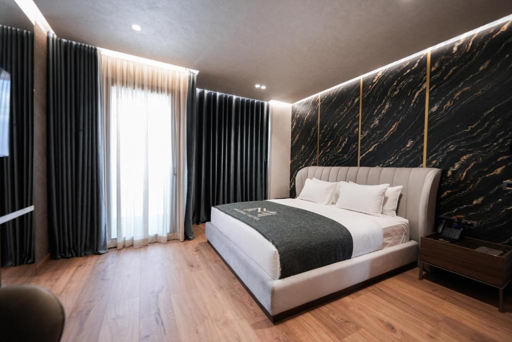 Postel nebo postele na pokoji v ubytování Marinaj Hotel & SPA