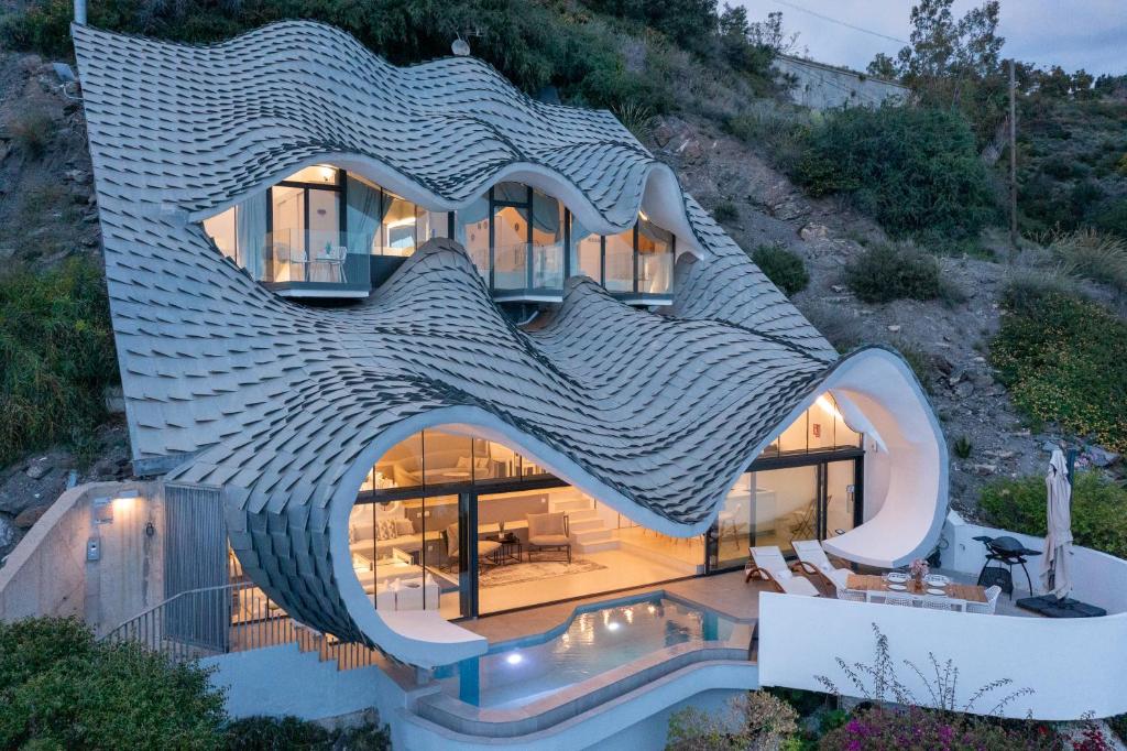 a house that is shaped like a fish at RentitSpain Casa Acantilado in Granada