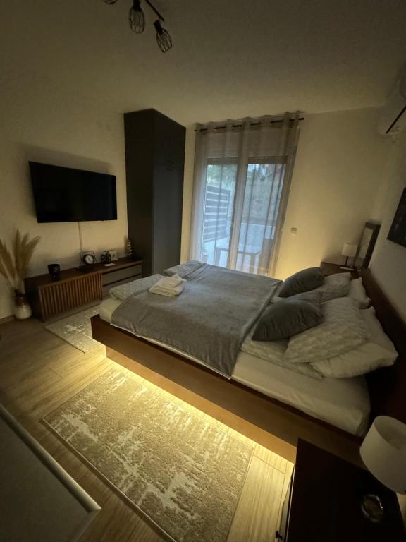 Postel nebo postele na pokoji v ubytování Apartmani Viver Vrnjačka Banja