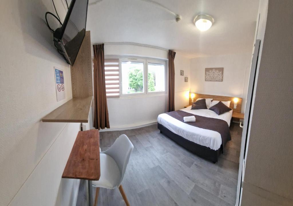 Postel nebo postele na pokoji v ubytování Hôtel OpalOriental