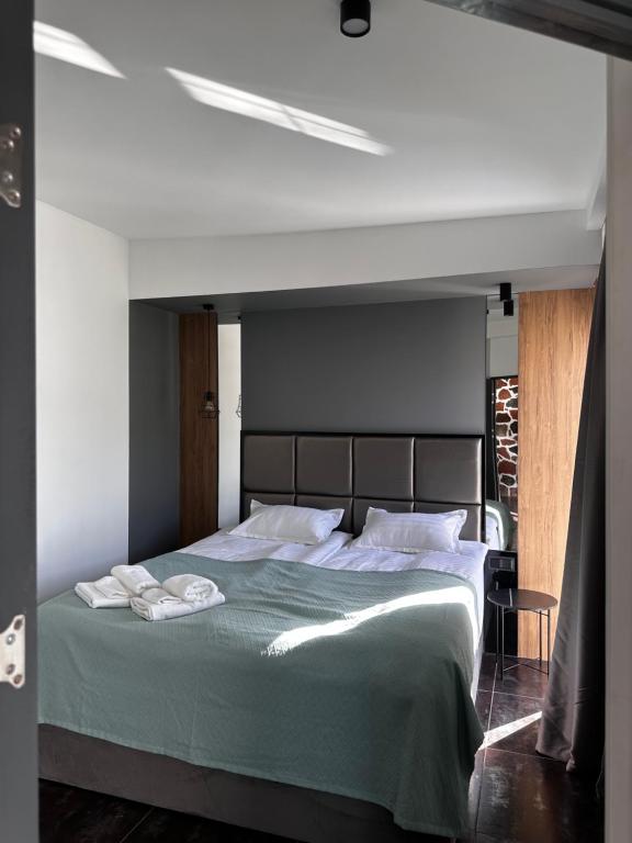 Postel nebo postele na pokoji v ubytování Garden Lounge Hotel