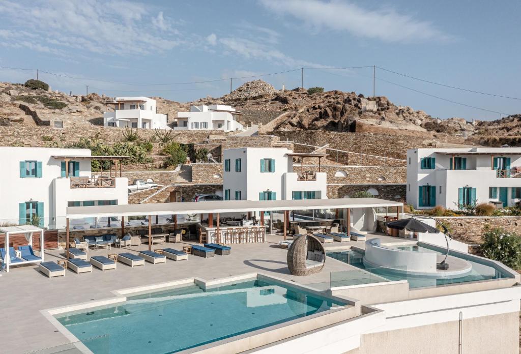 a resort with a swimming pool and buildings at Ios Sea View in Ios Chora