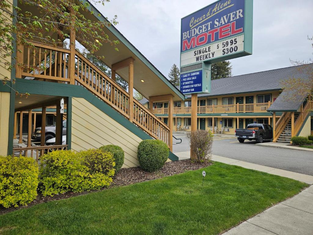 a building with a sign in front of a motel at Coeur D' Alene Budget Saver Motel in Coeur d'Alene
