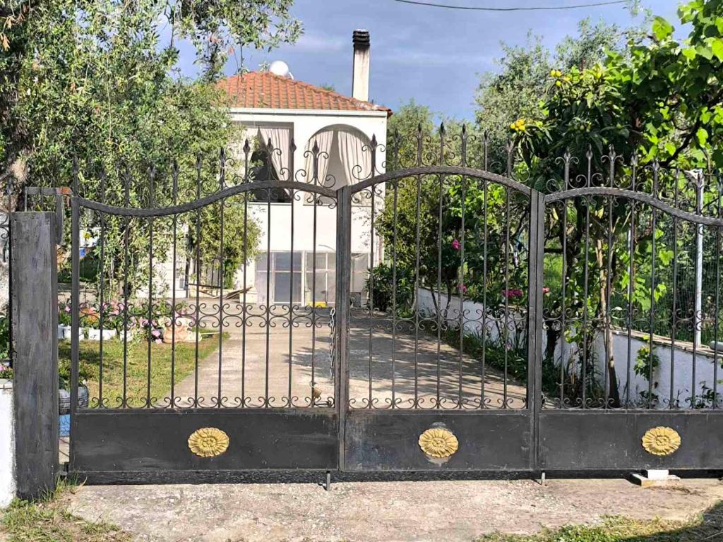 a black gate in front of a house at Anna's Garden House in Limenas