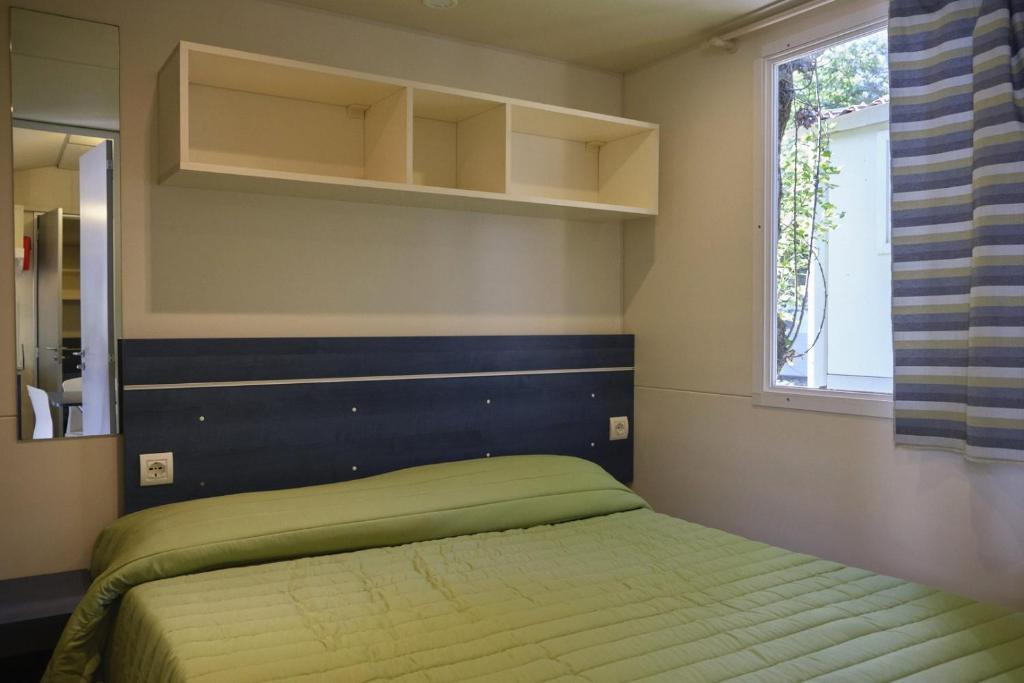 Postel nebo postele na pokoji v ubytování Camping Village la Chiocciola