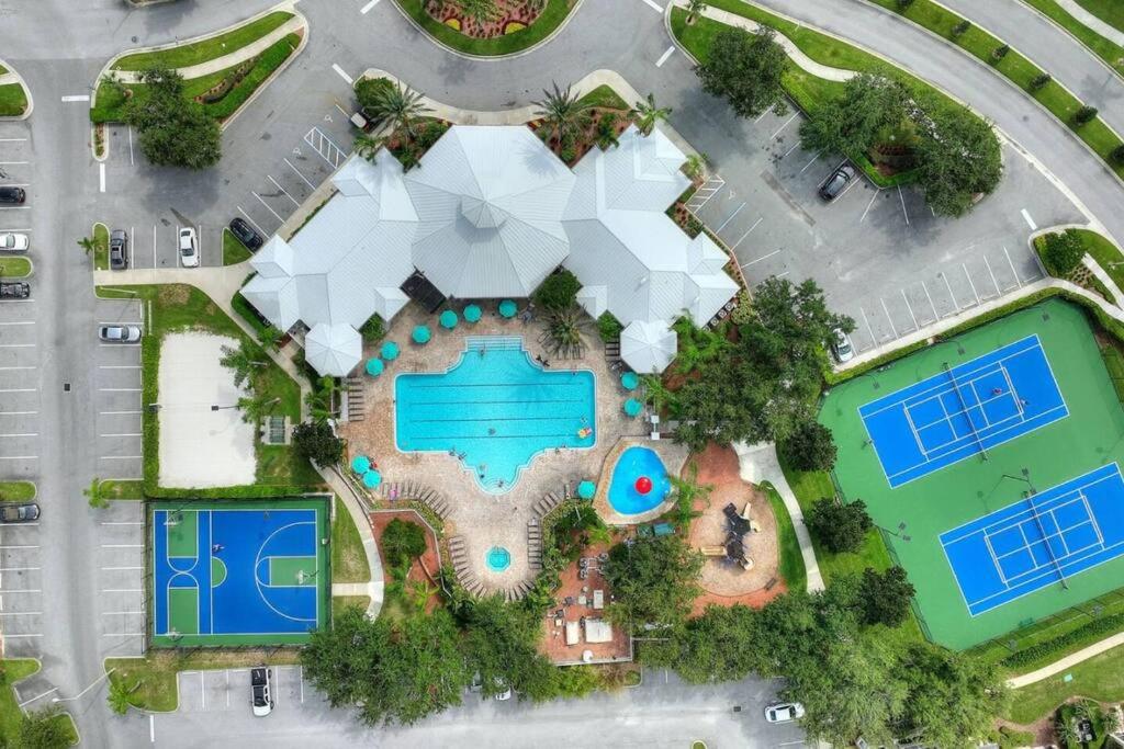 an overhead view of a resort with two swimming pools at Vacation Fantasia - Mins to Disney - Pool & Hot Tub in Kissimmee