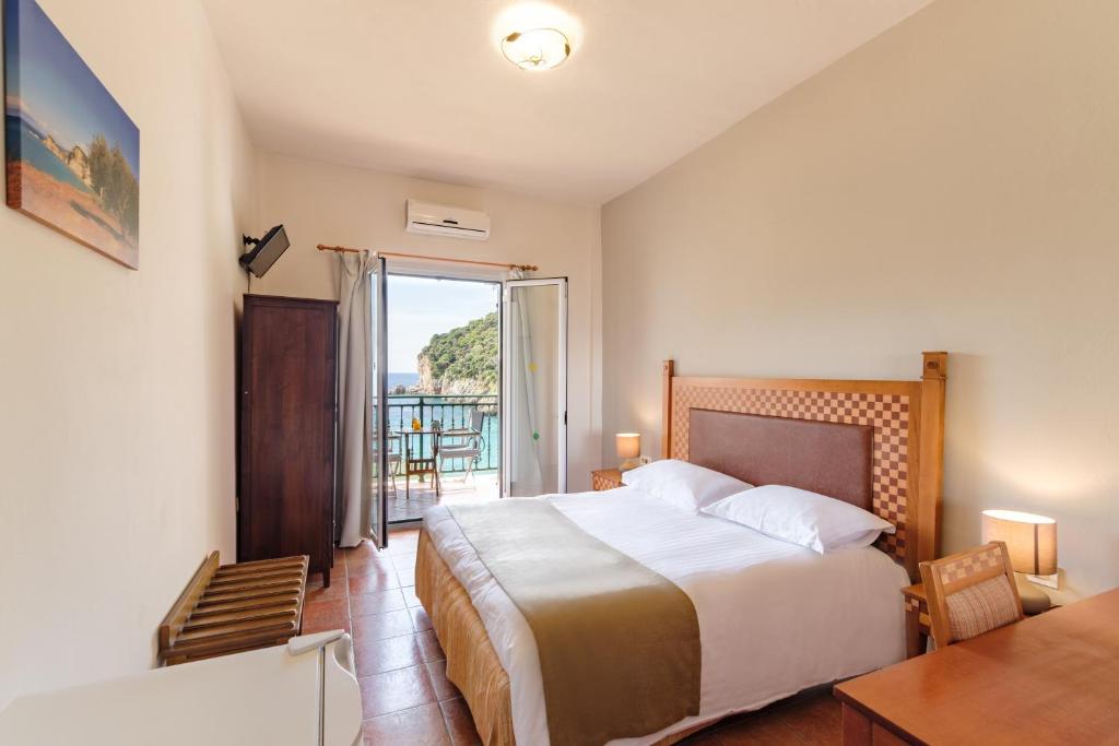 Postel nebo postele na pokoji v ubytování Hotel Apollon Corfu
