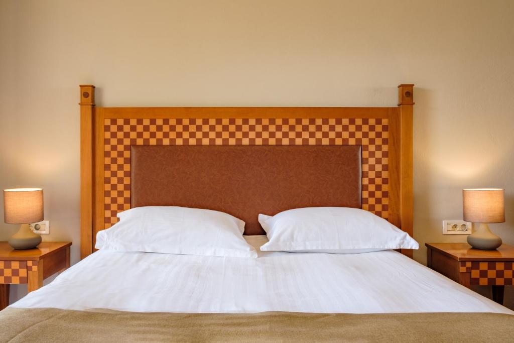 Postel nebo postele na pokoji v ubytování Hotel Apollon Corfu