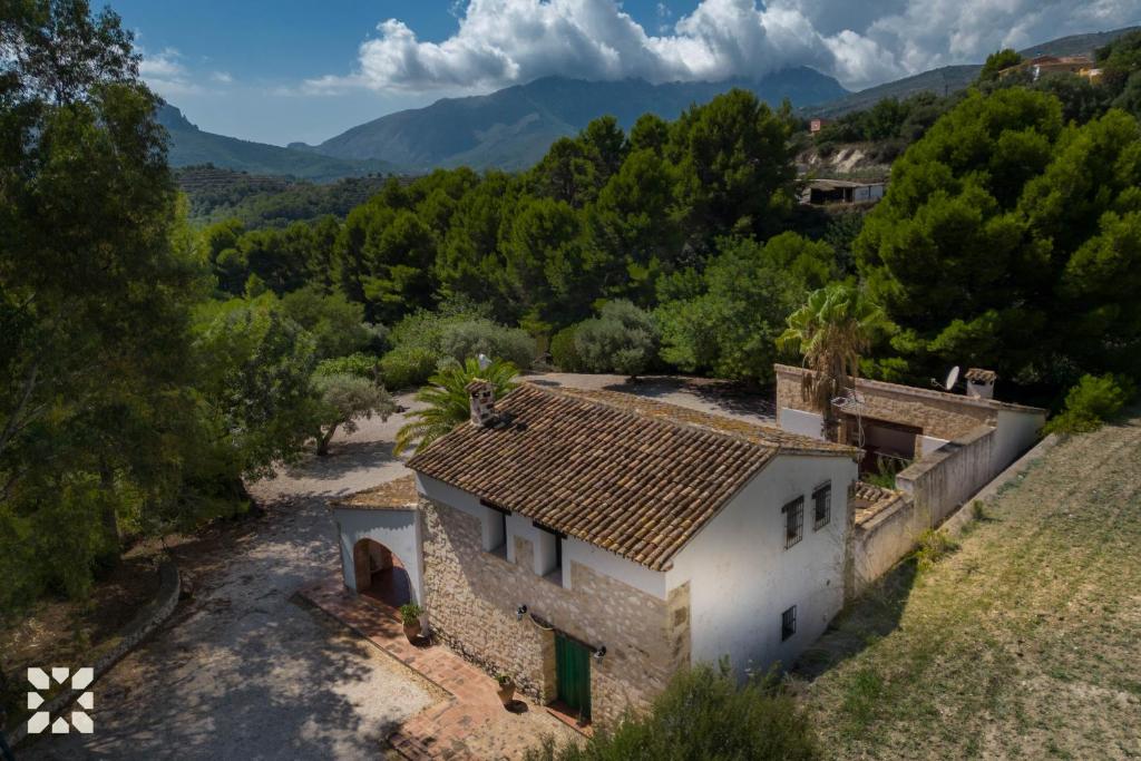 an aerial view of a house with mountains in the background at Villa Fantaxat by Abahana Villas in Benissa