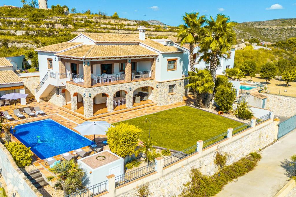 an aerial view of a villa with a swimming pool at Villa Fortezza by Abahana Villas in Benitachell